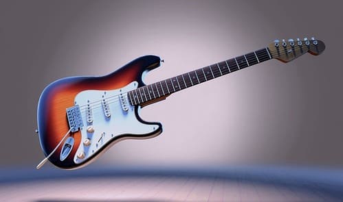 Eine E-Gitarre vor einem grauen Hintergrund